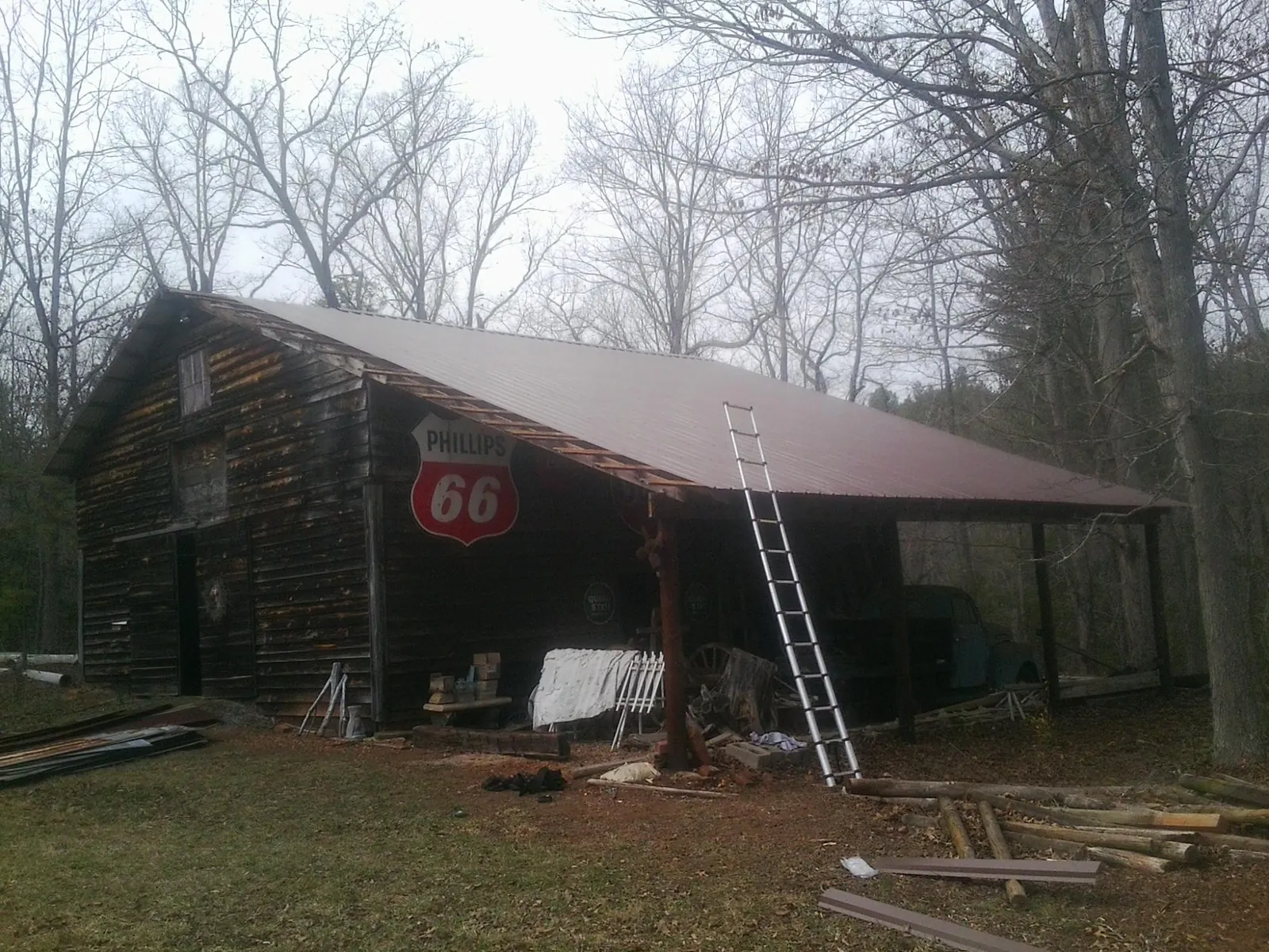 New metal roof on an open sided timber barn with a vintage sign in Indian Valley